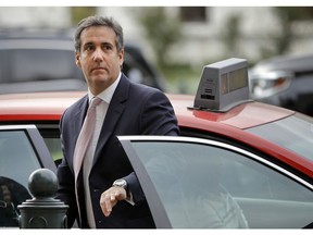 FILE - In this Sept. 19, 2017, file photo, Michael Cohen, President Donald Trump's personal attorney, steps out of a cab during his arrival on Capitol Hill in Washington.