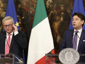 European Commission chief Jean-Claude Juncker and Italian Premier Giuseppe Conte, right, give a press conference following their meeting, at Palazzo Chigi, in Rome, Tuesday, April 2, 2019.