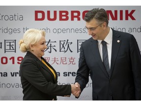 Croatia's Prime Minister Andrej Plenkovic, right, welcomes his Romanian counterpart Viorica Dancila at the Summit of Central and Eastern Europe and China in Dubrovnik, Croatia, Friday, April 12, 2019. EU member Croatia is hosting a two-day summit between China and 16 regional countries on expanding business between China and the region, which is dubbed 16+1.