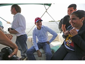 Juan Guaidó, opposition leader and self-proclaimed interim president of Venezuela, sits on a boat with staff members before crossing Maracaibo Lake to reach the town of Cabimas, Venezuela where he will lead a rally, Sunday, April 14, 2019. Guaidó was forced to take the boat in order to outmaneuver police roadblocks and reach throngs of supporters waiting to hear him speak.