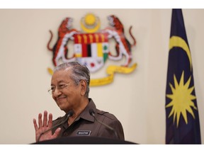 Malaysian Prime Minister Mahathir Mohamad gestures during a press conference in Putrajaya, Malaysia, Monday, April 15, 2019. Malaysia's government decided to resume a China-backed rail link project, after the Chinese contractor agreed to cut the construction cost by one-third.