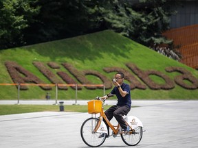 A employee rides a bicycle at Alibaba Xixi Park in Hangzhou, Zhejiang province of China.