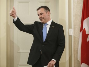 Jason Kenney gives a thumbs up as he is sworn in as premier of Alberta in Edmonton on Tuesday, April 30, 2019. The federal government is warning the new government in Alberta not to follow through on its promise to tear up the hard cap limiting total emissions from all the oil sands at 100 million tonnes a year.