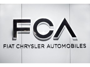 FILE - In this Monday, Jan. 14, 2019 file photo, Fiat Chrysler Automobiles FCA logo is shown at the North American International Auto Show in Detroit. Carmaker Fiat Chrysler Automobiles on Friday, May 3, 2019 reported a 47% drop in profits for the first quarter of 2019 due largely production shifts, but expressed confidence that new models will help the U.S.-Italian company meet full-year profit targets. The company reported net profits of 508 million euros ($566.5 million), down from 951 million euros in the same quarter a year earlier, while net revenue sank 5 percent to 24.5 billion euros.
