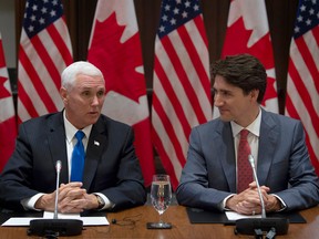 Prime Minister Justin Trudeau listens as U.S. Vice-President Mike Pence makes opening remarks at the Canadian Council for the USMCA on Parliament Hill.