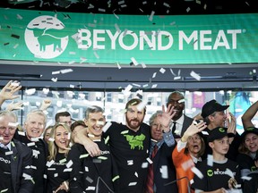 Beyond Meat CEO Ethan Brown, centre, celebrates with guests after ringing the opening bell at Nasdaq MarketSite, May 2, 2019 in New York City.