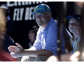 FILE - In this Jan 20, 2019, file photo, Australian Prime Minister Scott Morrison watches the fourth round match between Australia's Ashleigh Barty and Russia's Maria Sharapova on Rod Laver Arena at the Australian Open tennis championships in Melbourne, Australia. Saturday, May 18, 2019 is the last possible date that Morrison could have realistically chosen to hold an election.