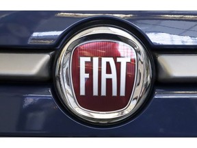 FILE - In this Feb. 14, 2019, file photo, this is the Fiat logo is mounted on a 2019 500 L on display at the 2019 Pittsburgh International Auto Show in Pittsburgh. Fiat Chrysler is proposing a merger with French carmaker Renault aimed at saving billions of dollars for both companies.