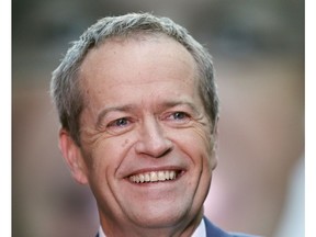 FILE - In this July 2, 2016, file photo, Australian Labor Party leader Bill Shorten speaks to supporters on a street after a breakfast show television interview on election day in Sydney. Shorten, the man most likely to become Australia's prime minister in elections on Saturday, May 18, 2019 has the support of his center-left Labor Party.