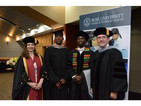 Keynote speaker Dr. Amanda Boag, St. Kitts and Nevis Deputy Prime Minister The Honourable Shawn Richards, graduate Elroy Williams and Ross University School of Veterinary Medicine Dean Sean Callanan pose for a photo before the 2019 Commencement Ceremony.