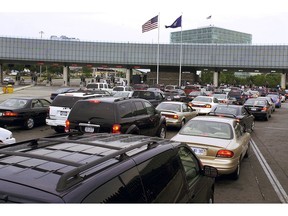 FILE - In this Aug. 4, 2005 file photo, traffic traveling from Niagara Falls, Ontario, Canada, lines up on the Rainbow Bridge to enter the United States through a border checkpoint at Niagara Falls, N.Y. Some along the northern U.S. border are worried the temporary transfer of hundreds of border agents south could cause backups of those seeking to enter the United States from Canada during the busy 2019 summer tourist season.