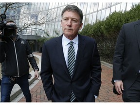 FILE - In this April 3, 2019 file photo, Bruce Isackson departs federal court in Boston after facing charges in a nationwide college admissions bribery scandal. In a court filing Monday, April 8, 2019, Isackson agreed to plead guilty in the cheating scam. Since dozens of wealthy parents and coaches at elite universities were arrested in March, two parents, including Isackson, and two coaches have agreed to cooperate with authorities.