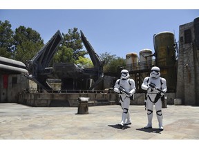 Stormtroopers patrol the Tie Echelon Stage during the Star Wars: Galaxy's Edge Media Preview at Disneyland Park, Wednesday, May 29, 2019, in Anaheim, Calif.