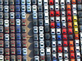 Cars are parked waiting to be exported at Yokohama port near Tokyo.