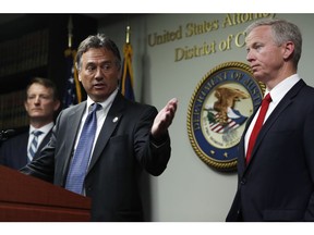 Dave Young, 17th Judicial District Attorney, front left, makes a point as George Brauchler, 18th Judicial District Attorney, front right, and U.S. Attorney Jason Dunn, back, look on during a news conference to announce that 42 people were arrested this week in one of the largest black market marijuana enforcement actions in the state's history during a news conference Friday, May 24, 2019, in Denver.