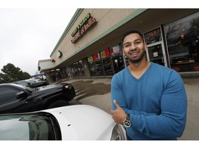 In this Tuesday, April 30, 2019 photo, Rashad Khan is shown outside his Indian restaurant in Boulder, Colo. A lawsuit against a Denver landlord who was recorded refusing to allow a Khan and his father, who are Muslim, to sublease her property for a restaurant has ended in a $675,000 settlement.