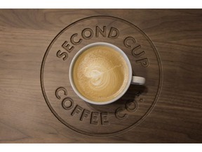 A detail shot of a flat white coffee at a Second Cup Coffee outlet in Toronto on Thursday, December 4, 2014. The Second Cup Ltd. says chief executive Garry Macdonald plans to retire at the end of the month.