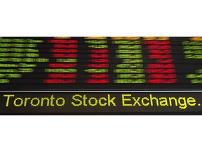 Financial numbers flow on the digital ticker tape at the TMX Group in Toronto's financial district on May 9, 2014.