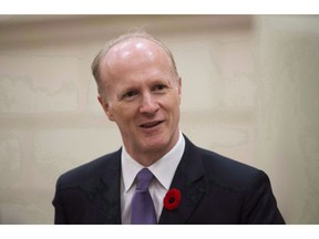 The Canada Pension Plan Investment Board is facing pressure to make a decision before end-of-year about whether or not to divest from investments in companies tied to human rights abuses in China. Canada Pension Plan Investment Board President and Chief Executive Officer Mark Machin waits to appear at the Standing Committee on Finance on Parliament Hill, in Ottawa on Tuesday, November 1, 2016.