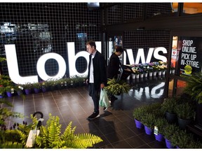 A man leaves a Loblaws store in Toronto on Thursday, May 3, 2018. Loblaw Companies Ltd. says technology will change the nature of work in the future, so it's investing not only in things like self-serve checkouts, but also retraining its workforce.