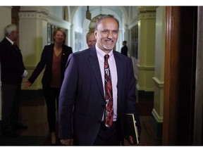 FILE-- Surrey-Newton NDP MLA Harry Bains arrives to the start of the debate at B.C. Legislature in Victoria on June 26, 2017. he momentum has shifted towards the labour movement in British Columbia with changes announced in provincial labour laws Tuesday.
