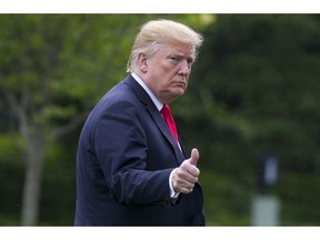 President Donald Trump gives thumbs up after arriving on Marine One on the South Lawn of the White House, Friday, May 17, 2019, in Washington. Trump is returning from a trip to New York.