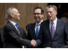 Treasury Secretary Steve Mnuchin, center, and United States Trade Representative Robert Lighthizer, right, speak with Chinese Vice Premier Liu He, left, as he departs the Office of the United States Trade Representative in Washington, Friday, May 10, 2019.