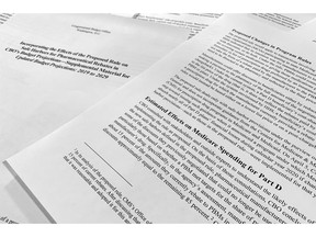 A report released on Thursday, May 2, 2019, by the Congressional Budget Office is photographed in Washington. Budget experts for Congress say the Trump administration's plan to reduce out-of-pocket drug costs for Medicare beneficiaries will cost taxpayers another $177 billion from 2020-2029.