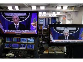 Television screens in the briefing room of the White House show a live statement from special counsel Robert Mueller as he speaks at the Justice Department, Wednesday May 29, 2019, in Washington.