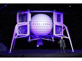 Jeff Bezos speaks in front of a model of Blue Origin's Blue Moon lunar lander, Thursday, May 9, 2019, in Washington.