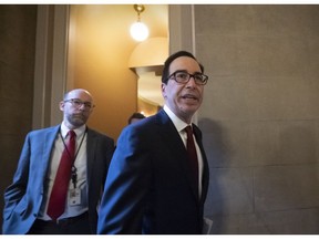 Treasury Secretary Steven Mnuchin leaves a meeting with top congressional leaders, including Speaker of the House Nancy Pelosi, D-Calif., and Senate Majority Leader Mitch McConnell, R-Ky., on a potential deal to raise the budget caps, at the Capitol in Washington, Tuesday, May 21, 2019. Mnuchin said they will be coming back for more talks later in the afternoon.