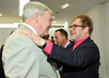 Conrad Black is greeted by Sir Elton John in Holt Renfrew in Toronto in 2012. The pop star was one of the celebrities who vouched for Black’s character.