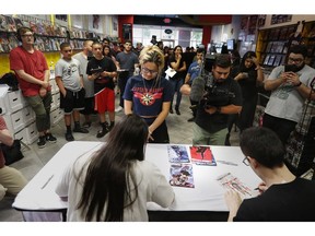 A large group of fans gather to get autographs from Steve Aoki during a comic book signing of his new "Neon Future" comic book series at Multiverse Corps. Comics on Thursday, May 2, 2019, in Miami.