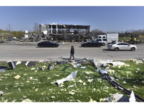 Debris is scattered across the street at the scene of an explosion at AB Specialty Silicones on Sunset Ave. and Northwestern Ave. on the border between Gurnee, Ill., and Waukegan. The explosion happened Friday night.