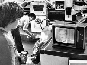 In this July 15, 1979 file photo, college student Chuck McManis watches President Jimmy Carter's nationally televised energy speech, which became known as the "malaise" speech. The U.S government is bigger than it was in 1979.