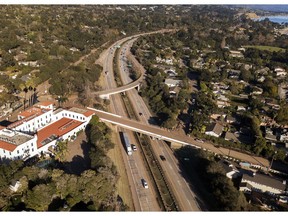 FILE - This Jan. 22, 2018 file photo from a news agency drone shows U.S. Highway 101 open to vehicle traffic in Montecito, Calif., after heavy rain brought flash flooding and mudslides that covered the highway two weeks earlier. In Utah, drones are hovering near avalanches to measure roaring snow. In North Carolina, they're combing the skies for the nests of endangered birds. In Kansas, meanwhile, they could soon be identifying sick cows through heat signatures. A survey released Monday, May 20, 2019 shows transportation agencies are using drones in nearly every U.S. state.