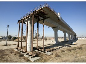 FILE - This Dec. 6, 2017, file photo shows one of the elevated sections of the high-speed rail under construction in Fresno, Calif. California has sued to block the Trump administration from cancelling nearly $1 billion for the state's high-speed rail project. The lawsuit filed Tuesday, May 21, 2019 comes after the administration revoked the funding last week. Gov. Gavin Newsom has called the move illegal and says it's political retribution for California's resistance to President Donald Trump's immigration policies.