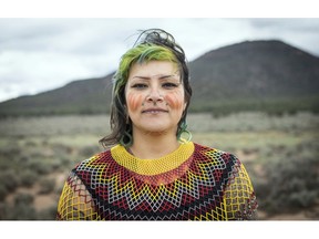 This undated photo provided by Amy Martin shows Ophelia Watahomigie-Corliss, a member of the Havasupai Tribal Council, at Red Butte, a site that the Havasupai consider sacred about 15 miles south of Tusayan, Ariz. Native American tribes are pushing the federal government to give them priority when it issues licenses that could expand internet coverage in their communities. Tribes in Oklahoma, Wisconsin, Washington, Idaho and others in Arizona also are pressing the FCC for a priority filing window. On the Havasupai Tribal Council, Watahomigie-Corliss is dubbed the telecommunications member.