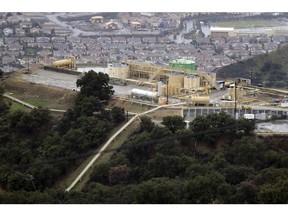 FILE - This Jan. 12, 2017, file photo shows gas gathering plant on a hilltop at the Southern California Gas Company's Aliso Canyon storage facility near the Porter Ranch neighborhood of Los Angeles. An investigation into the cause of the largest-known release of methane in the U.S. faults a California utility for the way it maintained its natural gas storage field before the massive 2015 blowout. The report released Friday, May 17, 2019, by the California Public Utilities Commission says Southern California Gas Co. did not assess its wells for disaster potential and did not investigate previous ruptures.