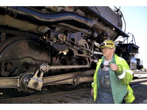 A worker walks past the wheels on the Big Boy No. 4014 at a Union Pacific restoration shop at the Cheyenne Depot Museum in Cheyenne, Wyo., Saturday, May 4, 2019. One of the world's biggest and most powerful steam locomotives is chugging to its big debut after five years of restoration work. From there, it goes to Ogden, Utah, to help celebrate the 150th anniversary of the Transcontinental Railroad.