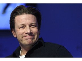 FILE - In this Wednesday, Jan. 18, 2017 file photo, British chef Jamie Oliver attends a panel session during the 47th annual meeting of the World Economic Forum, WEF, in Davos, Switzerland. Celebrity chef Jamie Oliver's British restaurant chain has become insolvent, putting 1,300 jobs at risk. The firm said Tuesday May 21, 2019, that it had gone into administration, a form of bankruptcy protection, and appointed KPMG to oversee the process.