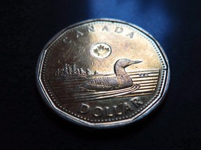 The loonie climbed on Friday after data showed the country added an above-forecast 106,500 jobs in April.
