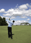 Pro golfer Sergio Garcia makes a shot on the final hole with the club house in the background at Magna Golf Club in Aurora, Ont. Frank Stronach founded the private club that has a membership roster of 270.