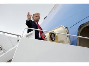 President Donald Trump boards Air Force One for a trip to Florida to tour areas impacted by Hurricane Michael, and to attend a political rally, Wednesday, May 8, 2019, at Andrews Air Force Base, Md.