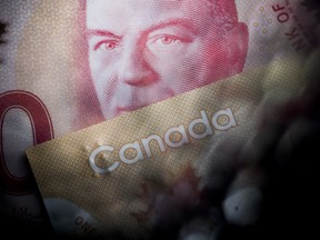 Canadian fifty dollar banknote depicting Former Prime Minister William Lyon Mackenzie King and a Canadian one hundred dollar banknote.