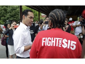 Presidential candidate and former U.S. Department of Housing and Urban Development Julian Castro speaks with a supporter prior to rallying with McDonald's employees and other activists demanding fairer pay, better working conditions, and the right to unionize in Durham, N.C., Thursday, May 23, 2019.