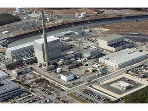 FILE - This July 8, 1998, file aerial photo shows the Oyster Creek Nuclear Generating Station in Lacey Township, N.J. A company that manufactures giant containers used to store spent radioactive fuel has signed a deal to purchase the plant, which ceased operation in September 2018, for accelerated decommissioning.