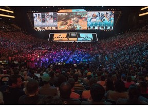 FILE - In this July 28, 2018, file photo, fans watch the competition between the Philadelphia Fusion and the London Spitfire during the Overwatch League Grand Finals, at Barclays Center in the Brooklyn borough of New York. Overwatch League Commissioner Nate Nanzer is leaving the competitive video game circuit to oversee esports competition for Fortnite publisher Epic Games. Nanzer tweeted Friday night, May 24, 2019, he was moving on from Activision Blizzard, the company behind the Overwatch game and league, for a "new opportunity." He didn't provide further details or a firm timeline except to say he'll be leaving "soon." Epic Games tells ESPN they will hire Nanzer to help turn the world's most popular video game into a viable esport.