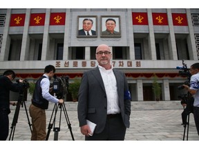 This Monday, May 9, 2016 photo shows The Associated Press' North Korea Bureau Chief Eric Talmadge in front of the April 25 House of Culture where the party congress is held in the North Korean capital of Pyongyang. Talmadge, who tenaciously chronicled life and politics in North Korea, one of the world's least-understood nations, died after suffering a heart attack in Japan. He was 57.