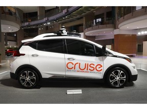 FILE - In this Jan. 16, 2019, file photo, Cruise AV, General Motor's autonomous electric Bolt EV is displayed in Detroit. A group of institutional investors is sinking $1.15 billion into GM Cruise LLC, the autonomous vehicle unit of General Motors. GM announced the investment from a group led by T. Rowe Price on Tuesday, May 7, and said it included money from GM, Honda and Japanese tech investment firm SoftBank.